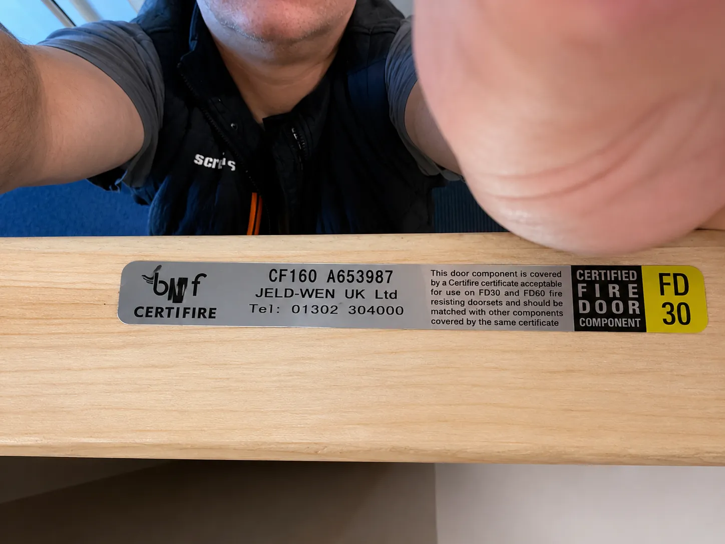 Certifire FD30 certified fire door component label on a doorset